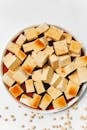 Close-up of tofu cubes in soy sauce, ideal for healthy eating visuals.