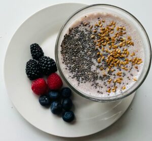 Close-up of a smoothie bowl with chia seeds, flaxseed, and fresh berries, perfect for a wholesome breakfast.